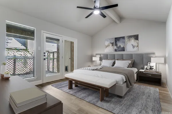 a bedroom with a bed and glass window