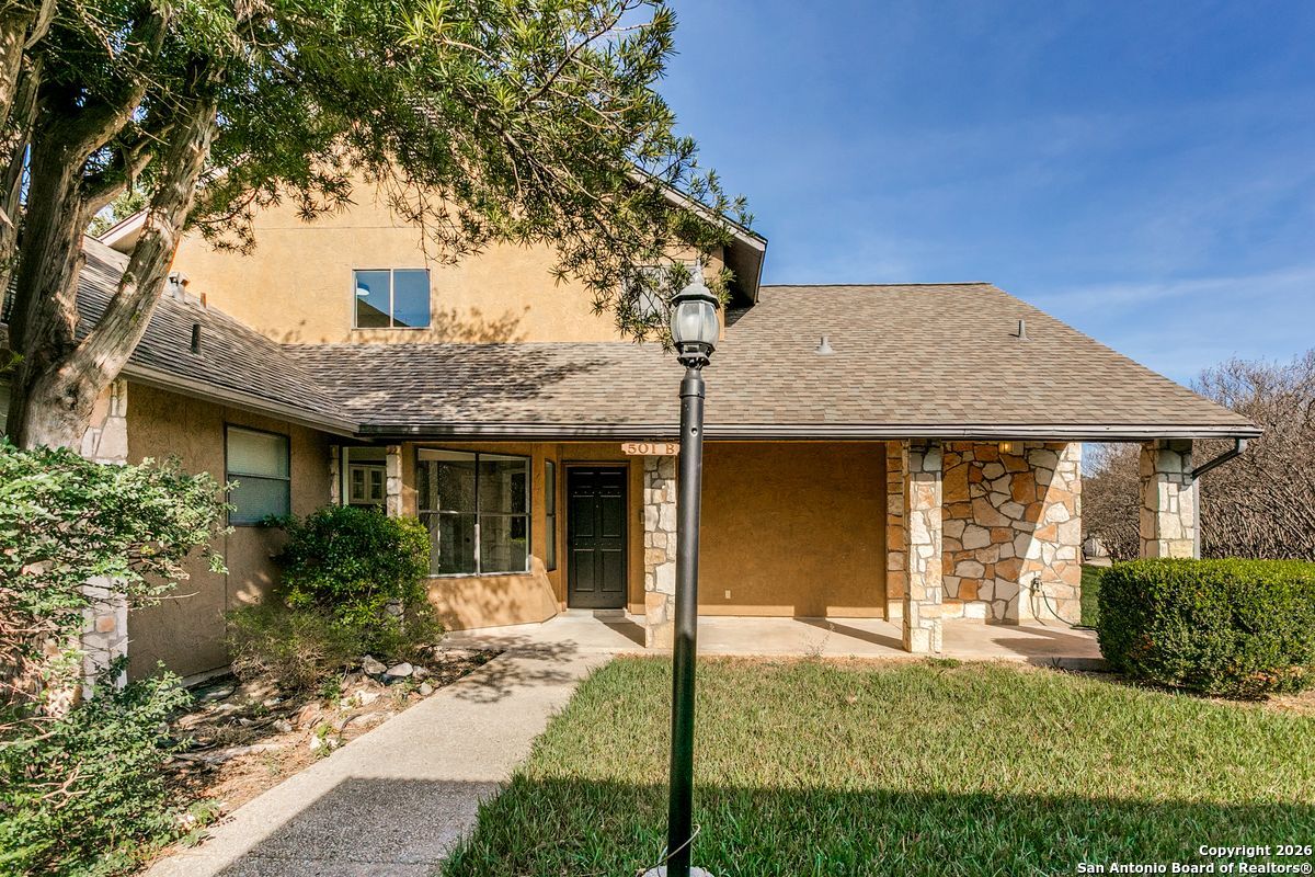 9380 Braun Road, Unit 501B San Antonio, TX 78254 - Photo 5 of 29 a front view of a house with garden