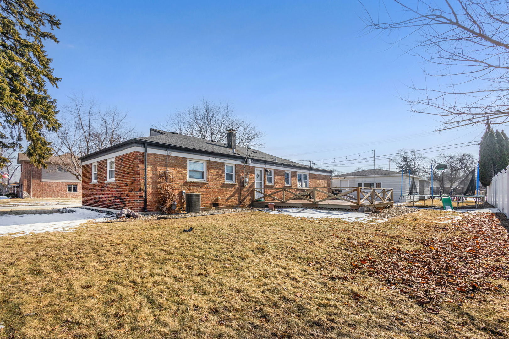 5901 108th Place Chicago Ridge, IL 60415 - Photo 2 of 15 a big house with a large tree in front of it