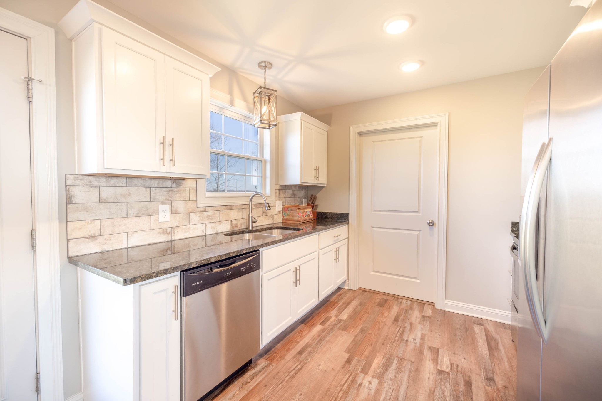 950 White Road Portland, TN 37148 - Photo 11 of 35 a kitchen with a sink stove and cabinets
