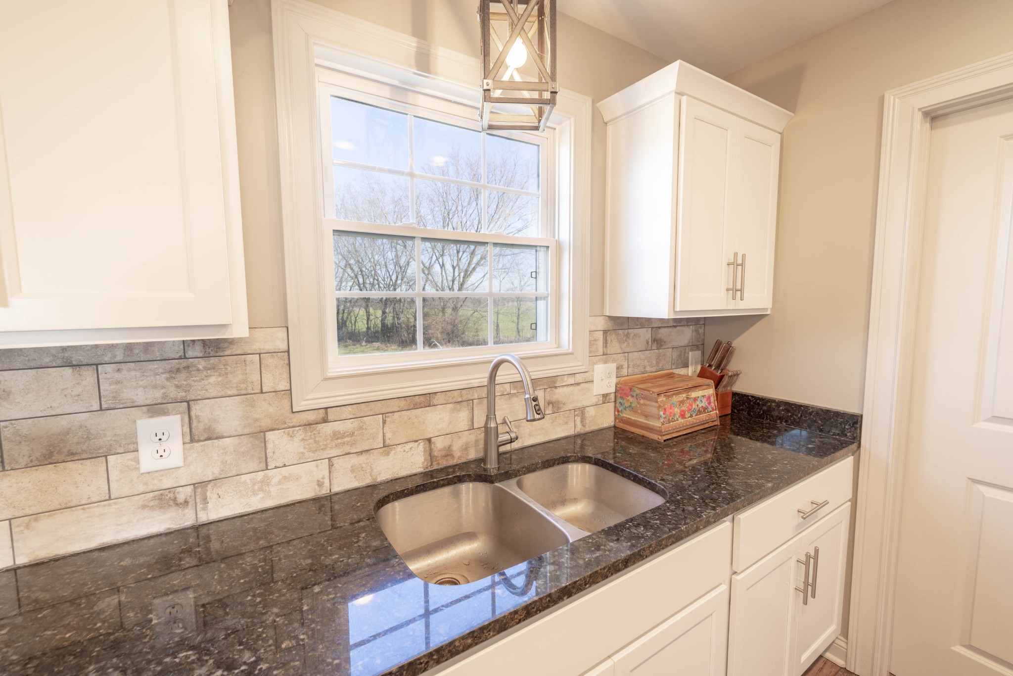 950 White Road Portland, TN 37148 - Photo 12 of 35 a kitchen with granite countertop a sink a counter top space and cabinets