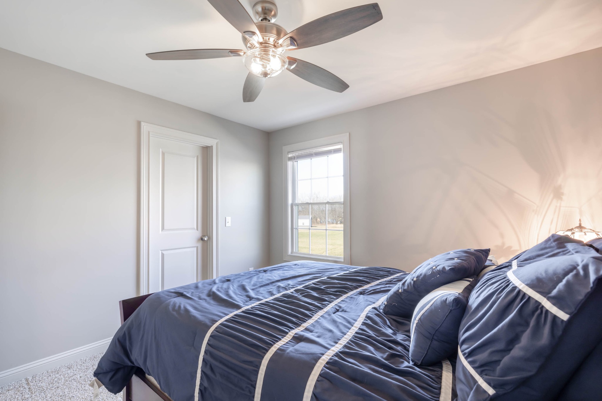 950 White Road Portland, TN 37148 - Photo 24 of 35 a bedroom with a bed and a chandelier