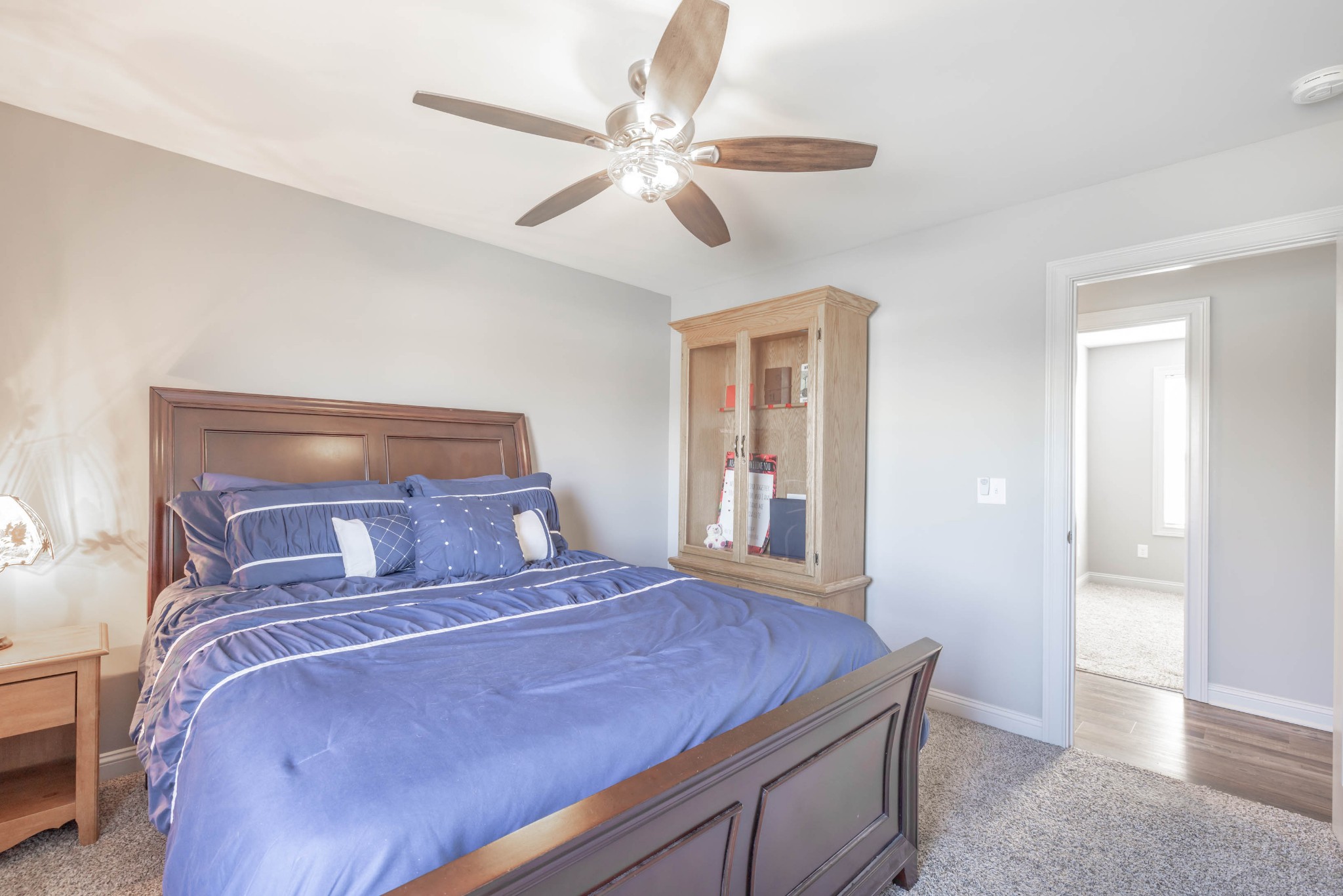950 White Road Portland, TN 37148 - Photo 26 of 35 a bedroom with a large bed and a chandelier