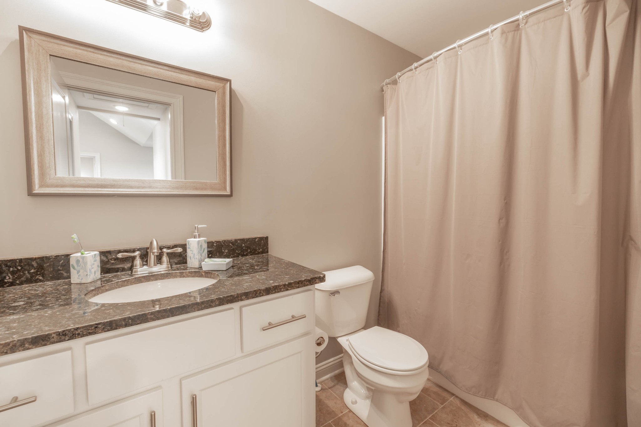 950 White Road Portland, TN 37148 - Photo 31 of 35 a bathroom with a granite countertop toilet sink and mirror