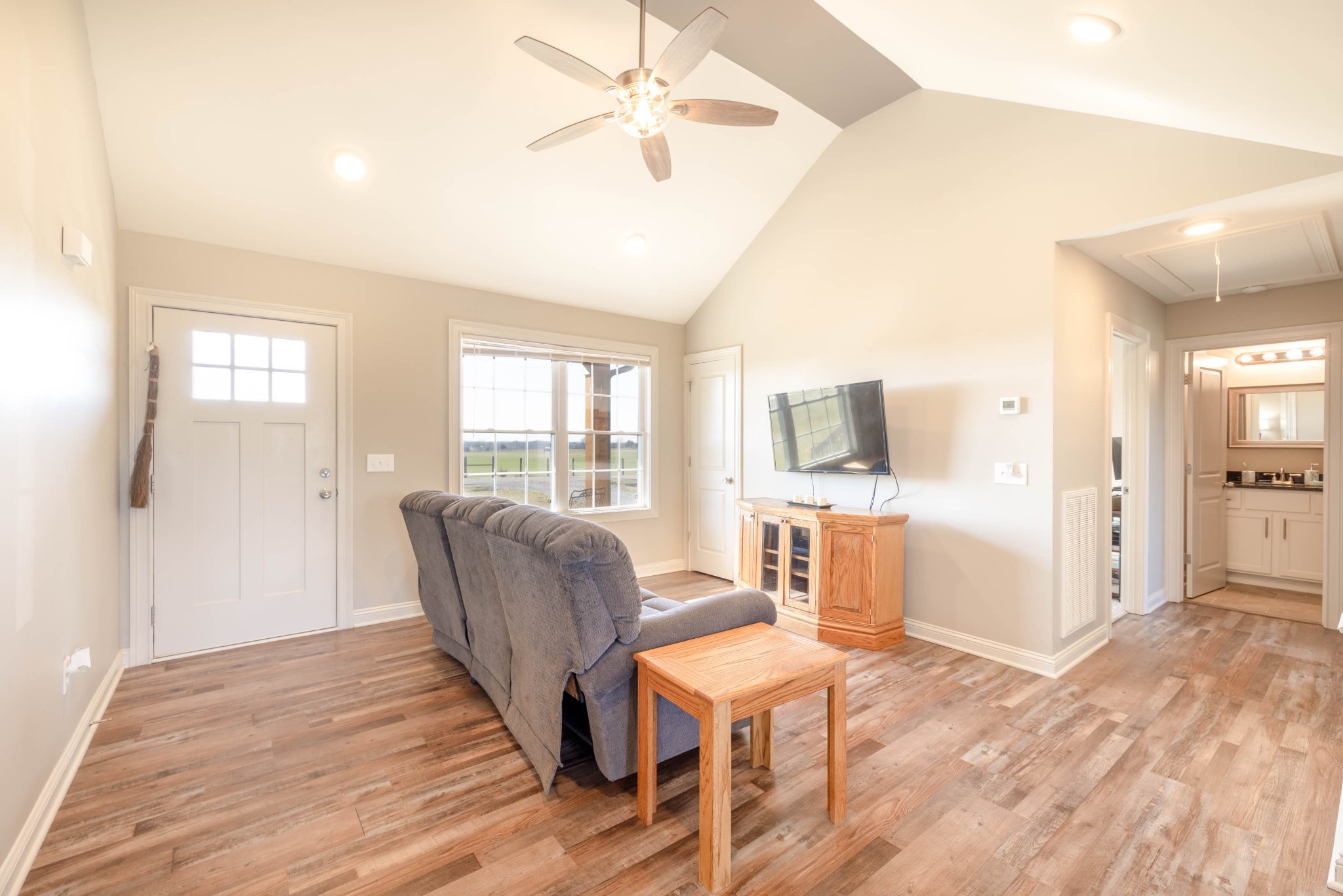 950 White Road Portland, TN 37148 - Photo 9 of 35 a living room with furniture a flat screen tv and wooden floor