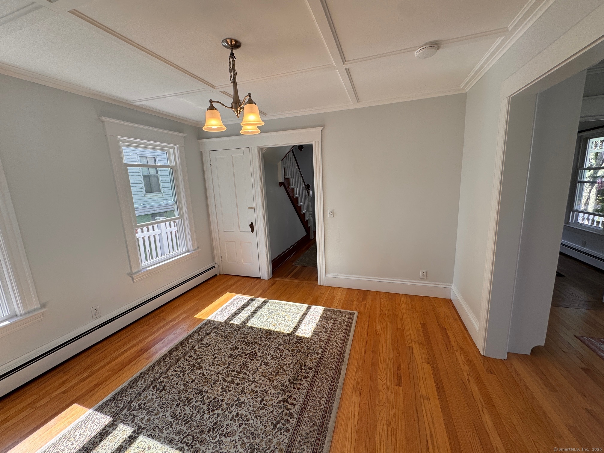 17 High Street Groton, CT 06340 - Photo 21 of 37 a view of empty room with wooden floor and window
