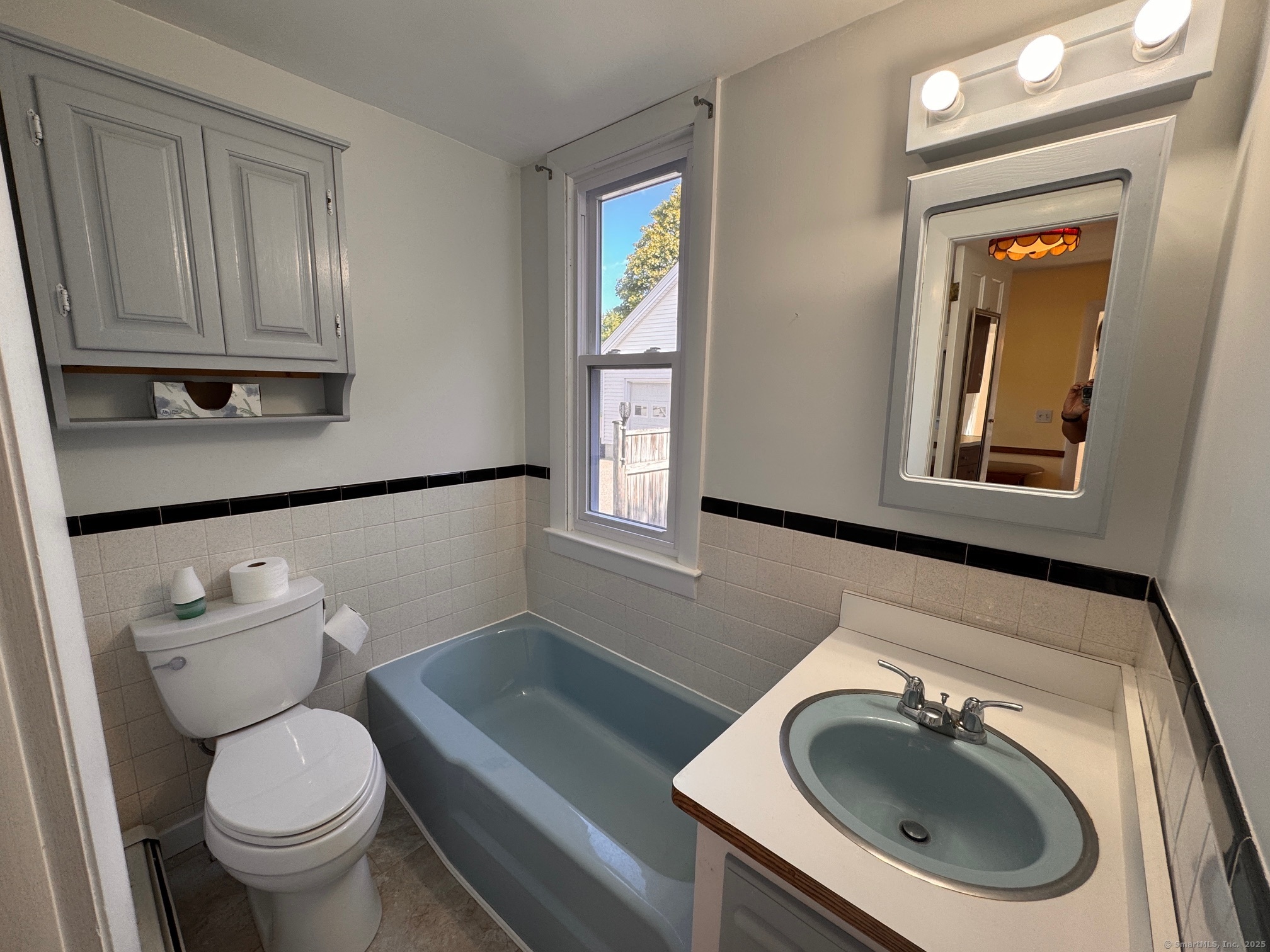 17 High Street Groton, CT 06340 - Photo 24 of 37 a bathroom with a toilet a sink and mirror