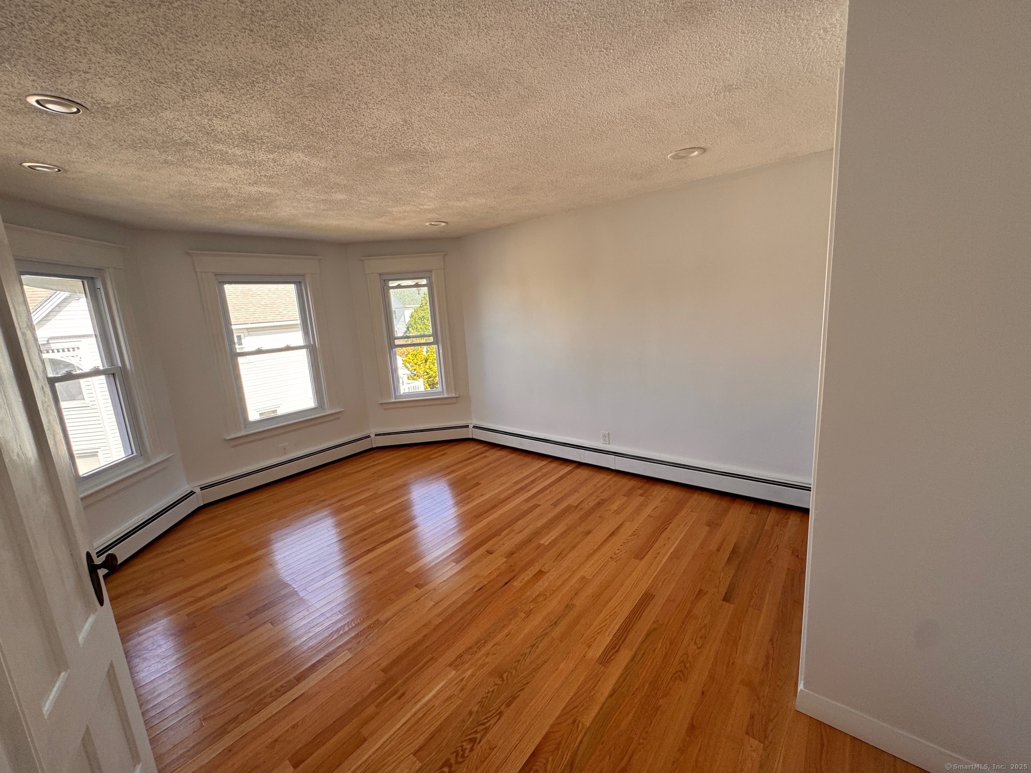 17 High Street Groton, CT 06340 - Photo 26 of 37 wooden floor in an empty room with a window