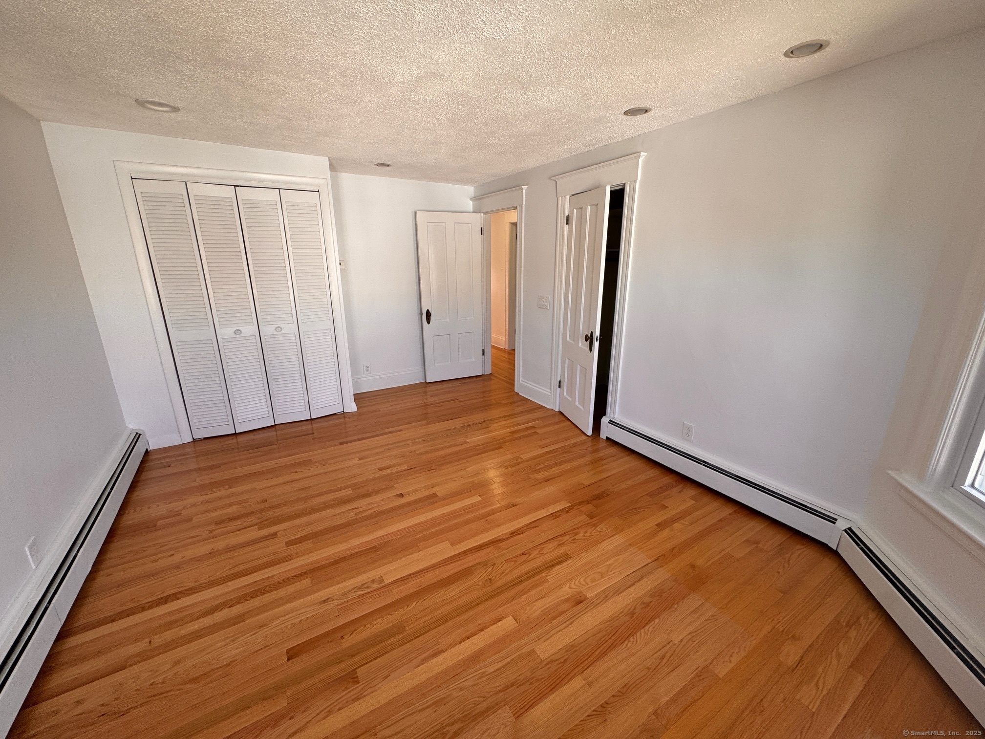 17 High Street Groton, CT 06340 - Photo 27 of 37 a view of empty room with wooden floor