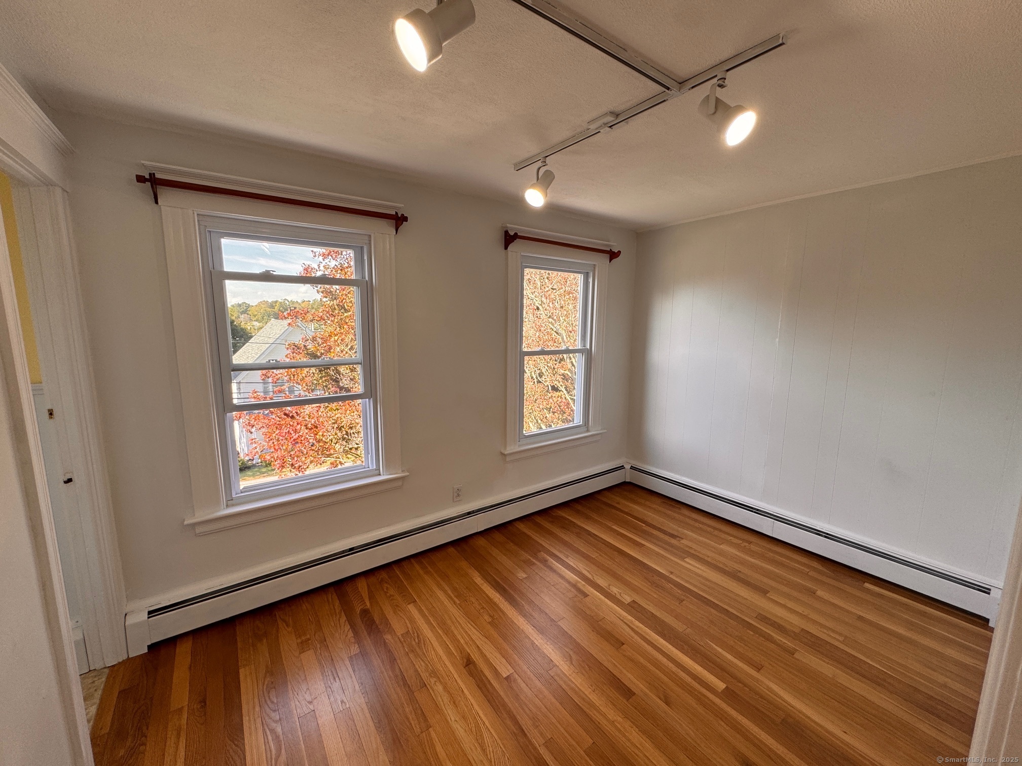 17 High Street Groton, CT 06340 - Photo 28 of 37 a view of an empty room with wooden floor and a window