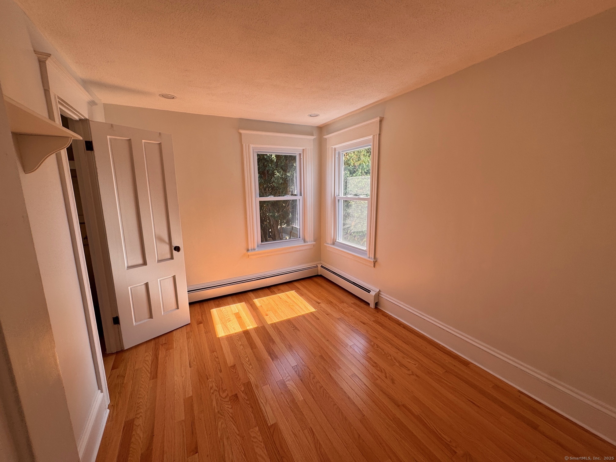 17 High Street Groton, CT 06340 - Photo 31 of 37 a view of an empty room with wooden floor and a window