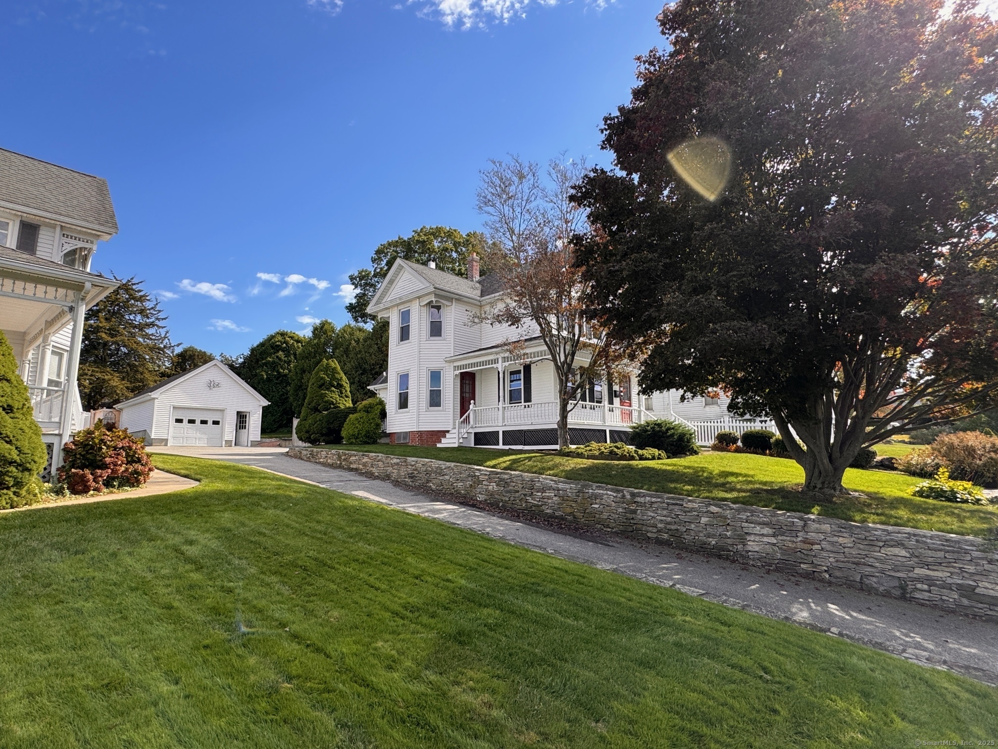 17 High Street Groton, CT 06340 - Photo 4 of 37 a view of a house with a big yard and large trees
