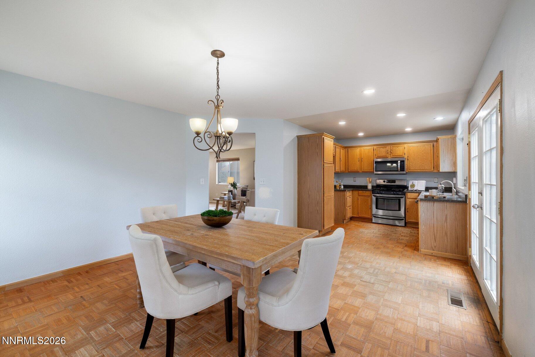 8486 Piper Place Reno, NV 89506 - Photo 15 of 80 a view of a dining room with furniture
