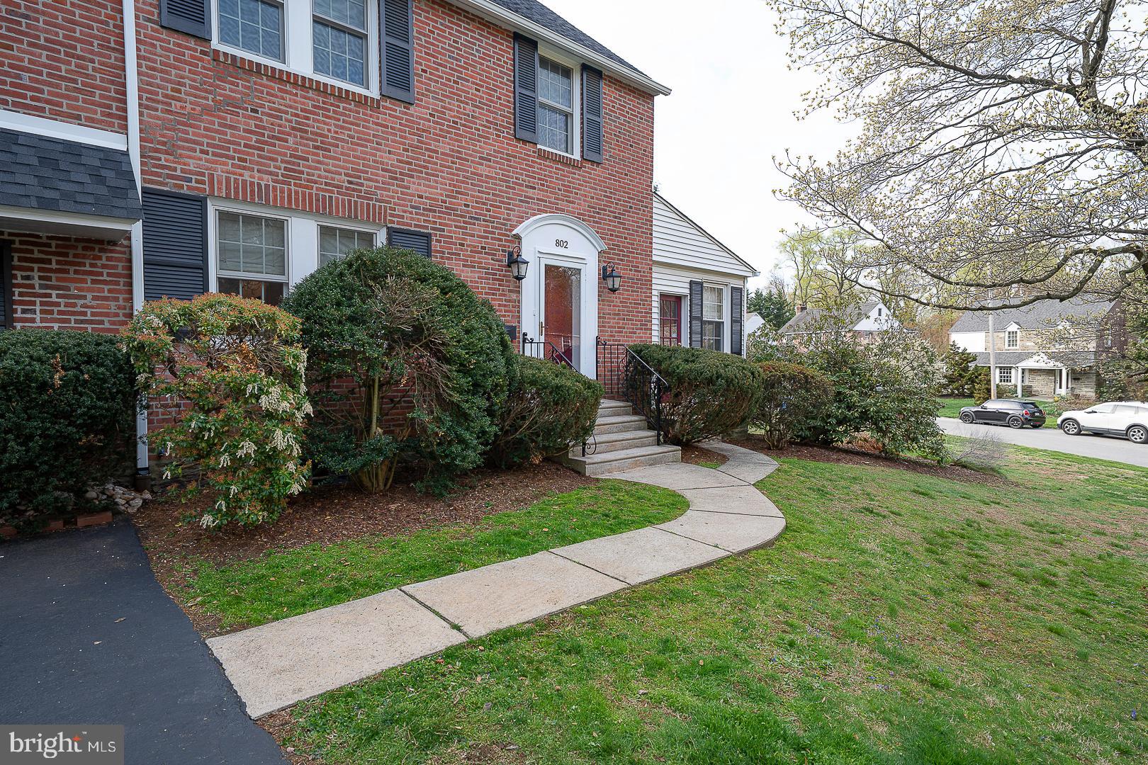 802 Pleasant Hill Road Wallingford, PA 19086 - Photo 2 of 44 a front view of a house with garden