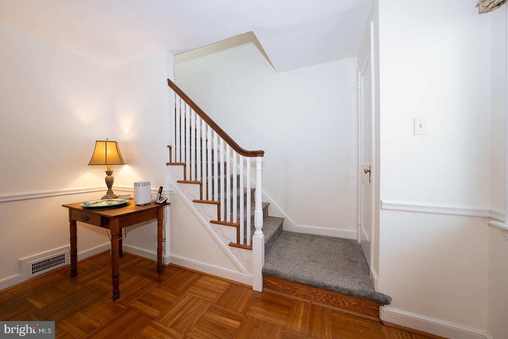 802 Pleasant Hill Road Wallingford, PA 19086 - Photo 24 of 44 a view of a hallway with wooden floor and staircase