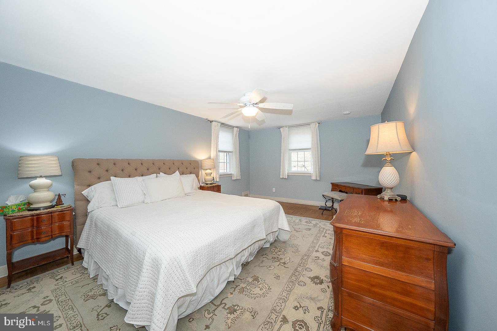 802 Pleasant Hill Road Wallingford, PA 19086 - Photo 25 of 44 a bedroom with a bed and a lamp
