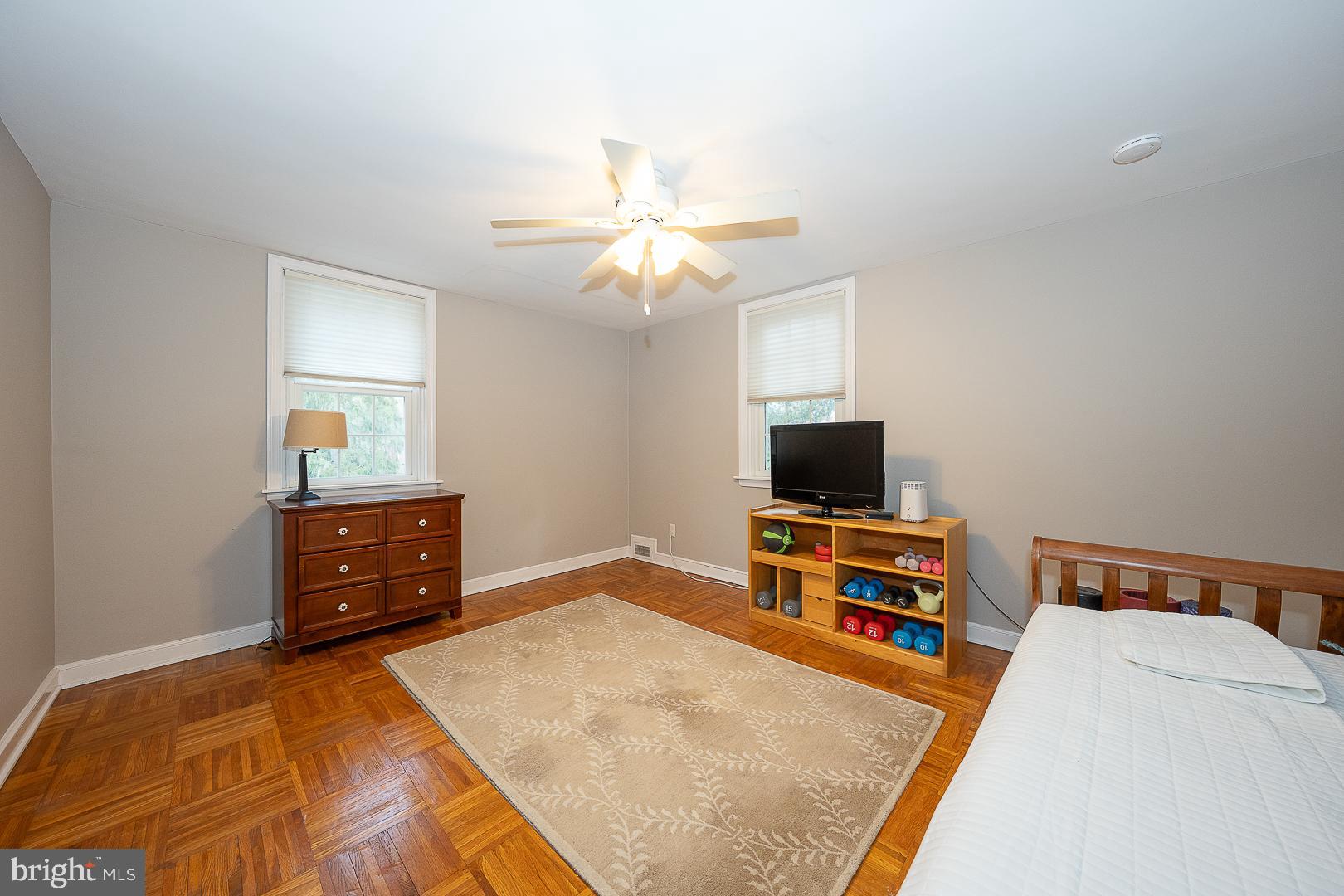 802 Pleasant Hill Road Wallingford, PA 19086 - Photo 29 of 44 a bedroom with a bed and a flat screen tv