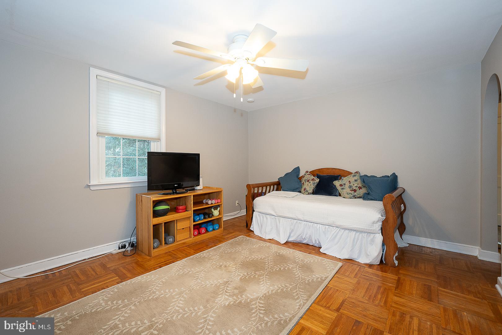 802 Pleasant Hill Road Wallingford, PA 19086 - Photo 30 of 44 a bedroom with a bed and a flat screen tv