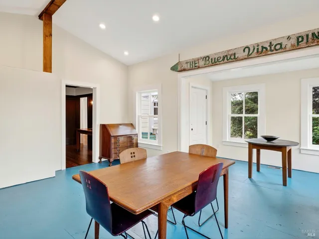 a view of a room with a window and furniture