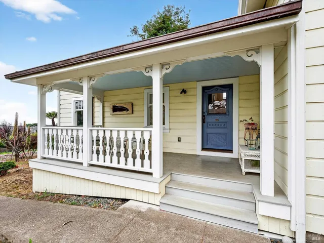 a view of a balcony with furniture