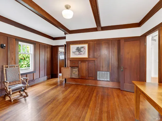 a view of a livingroom with hardwood and furniture