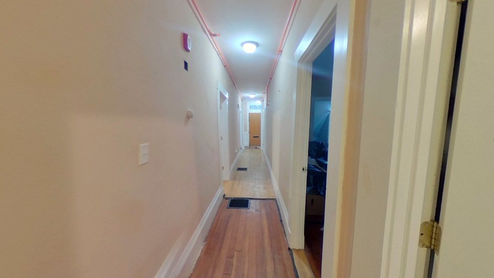 3147-3149 Washington Street, Unit 2 Boston, MA 02130 - Photo 4 of 5 a view of a hallway with wooden floor