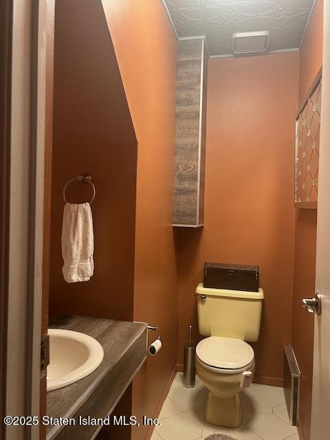 45 Daffodil Court Staten Island, NY 10312 - Photo 17 of 37 a bathroom with a toilet sink and mirror