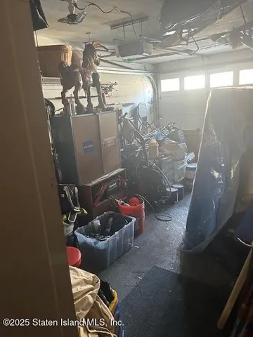 a room with water heater and wooden floor