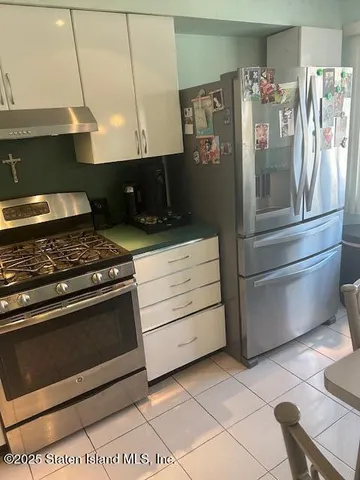 a kitchen with appliances and cabinets