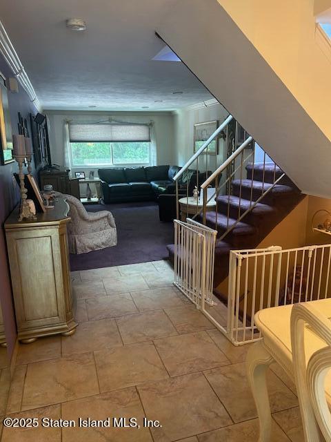 45 Daffodil Court Staten Island, NY 10312 - Photo 7 of 37 a view of a livingroom with furniture stairs and a floor to ceiling window