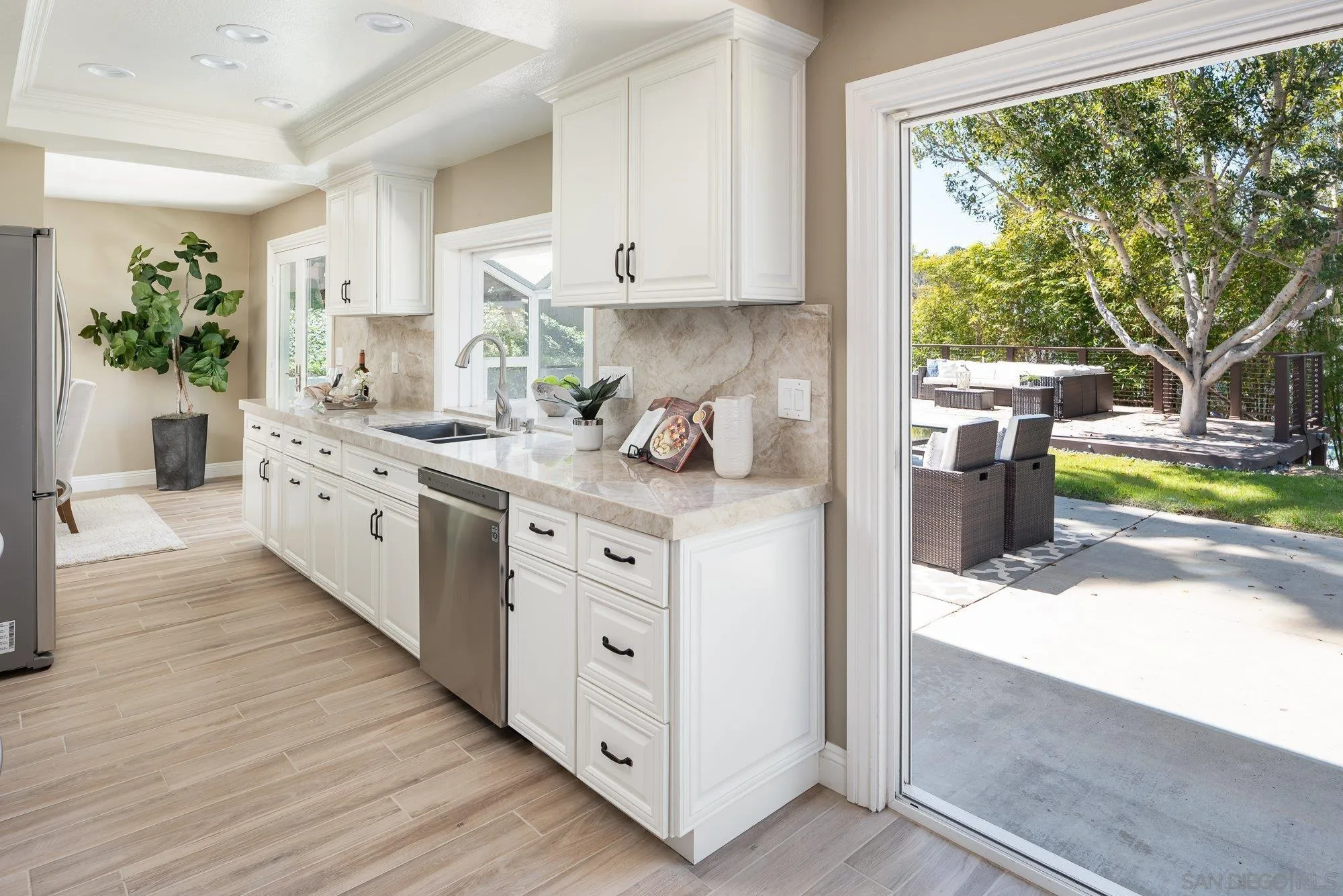 1414 Flair Encinitas Drive Encinitas, CA 92024 - Photo 11 of 41 a kitchen with a sink stove and cabinets