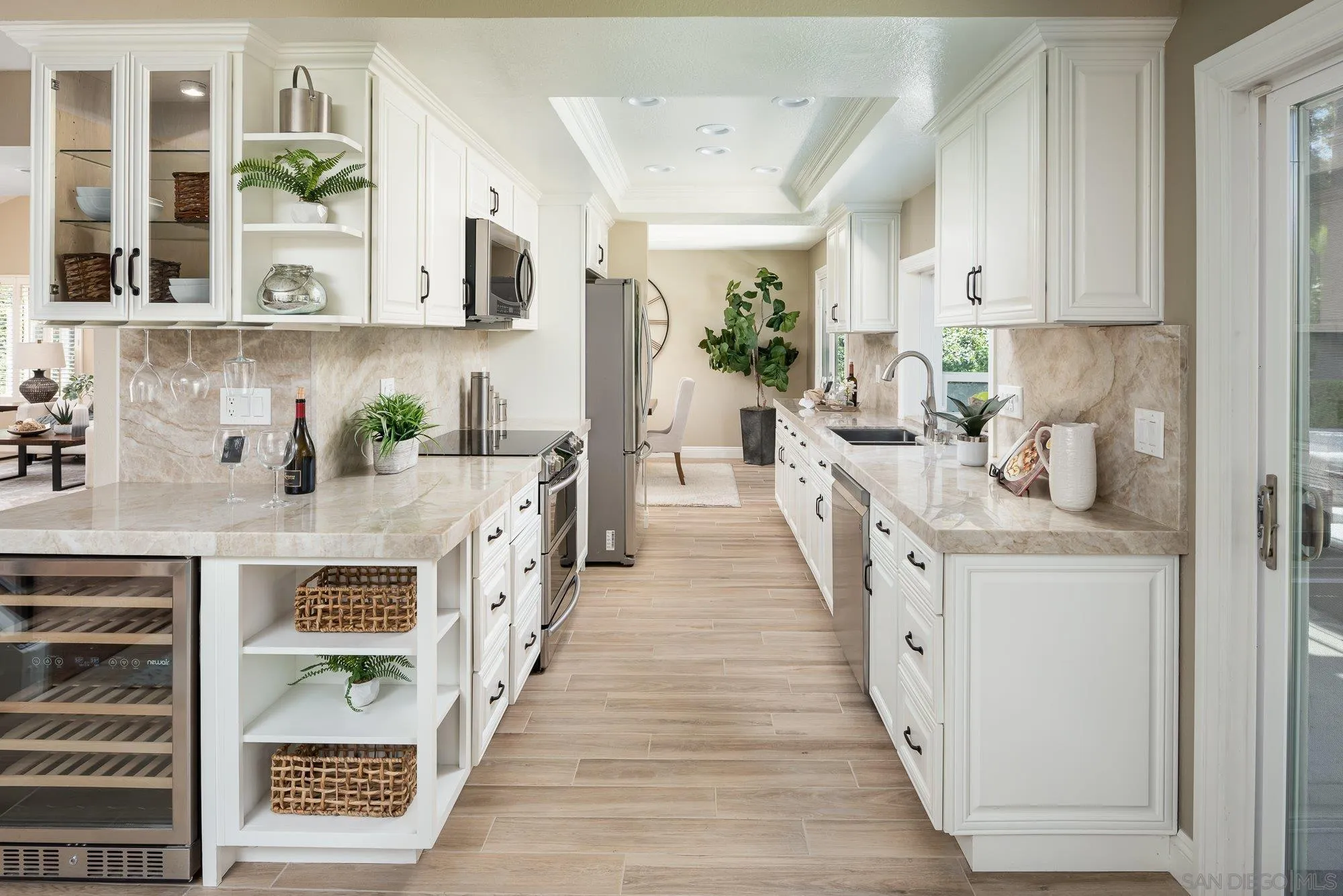 1414 Flair Encinitas Drive Encinitas, CA 92024 - Photo 12 of 41 a open kitchen with stainless steel appliances granite countertop lots of counter space a sink and a refrigerator