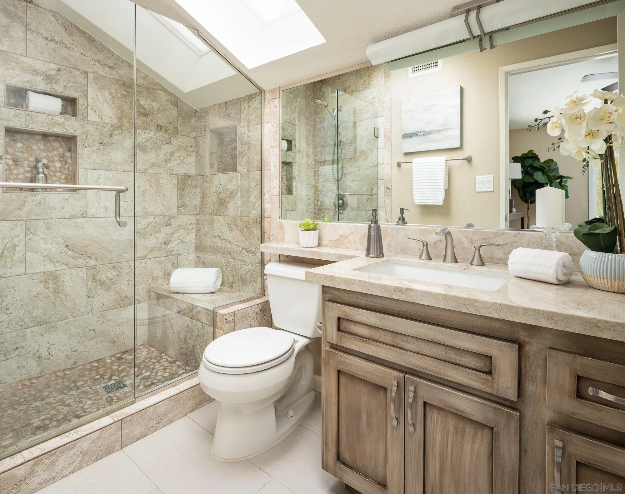 1414 Flair Encinitas Drive Encinitas, CA 92024 - Photo 18 of 41 a bathroom with a sink toilet and shower