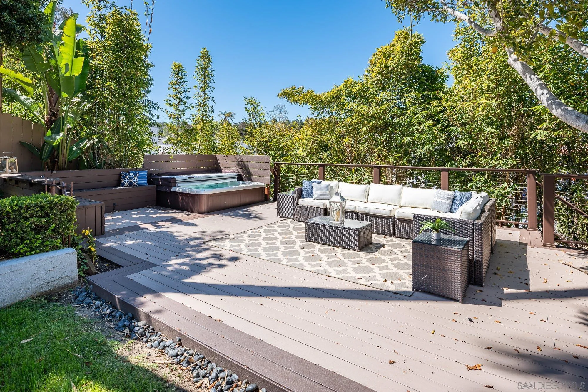 1414 Flair Encinitas Drive Encinitas, CA 92024 - Photo 24 of 41 a view of a patio with couches chairs potted plants and a palm tree