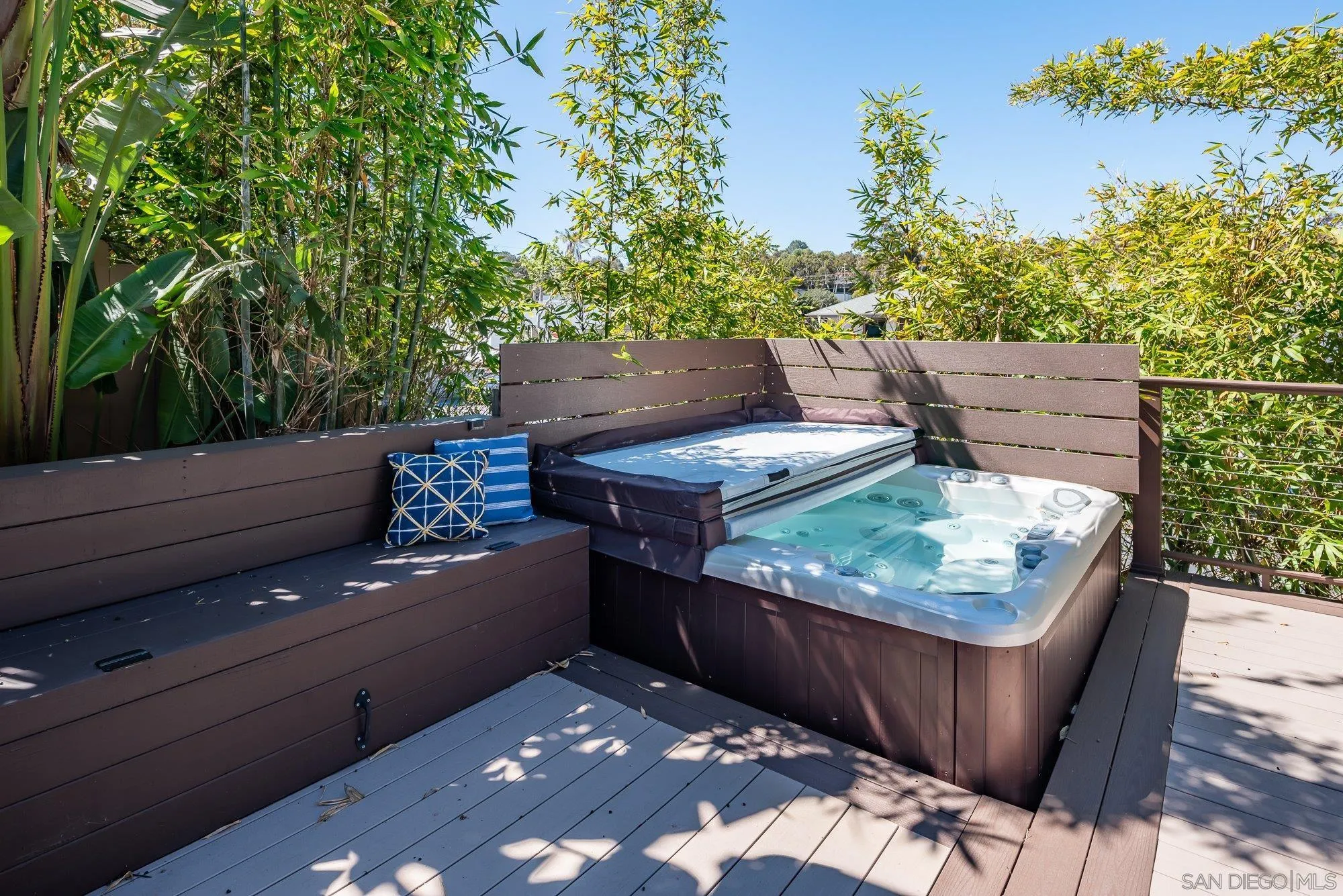 1414 Flair Encinitas Drive Encinitas, CA 92024 - Photo 25 of 41 a wooden bench sitting in the backyard of a house