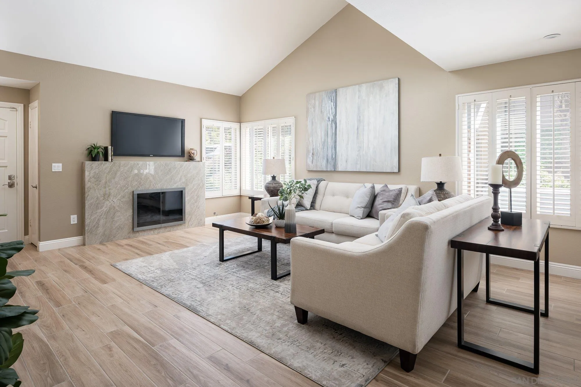 1414 Flair Encinitas Drive Encinitas, CA 92024 - Photo 5 of 41 a living room with furniture a flat screen tv and a fireplace