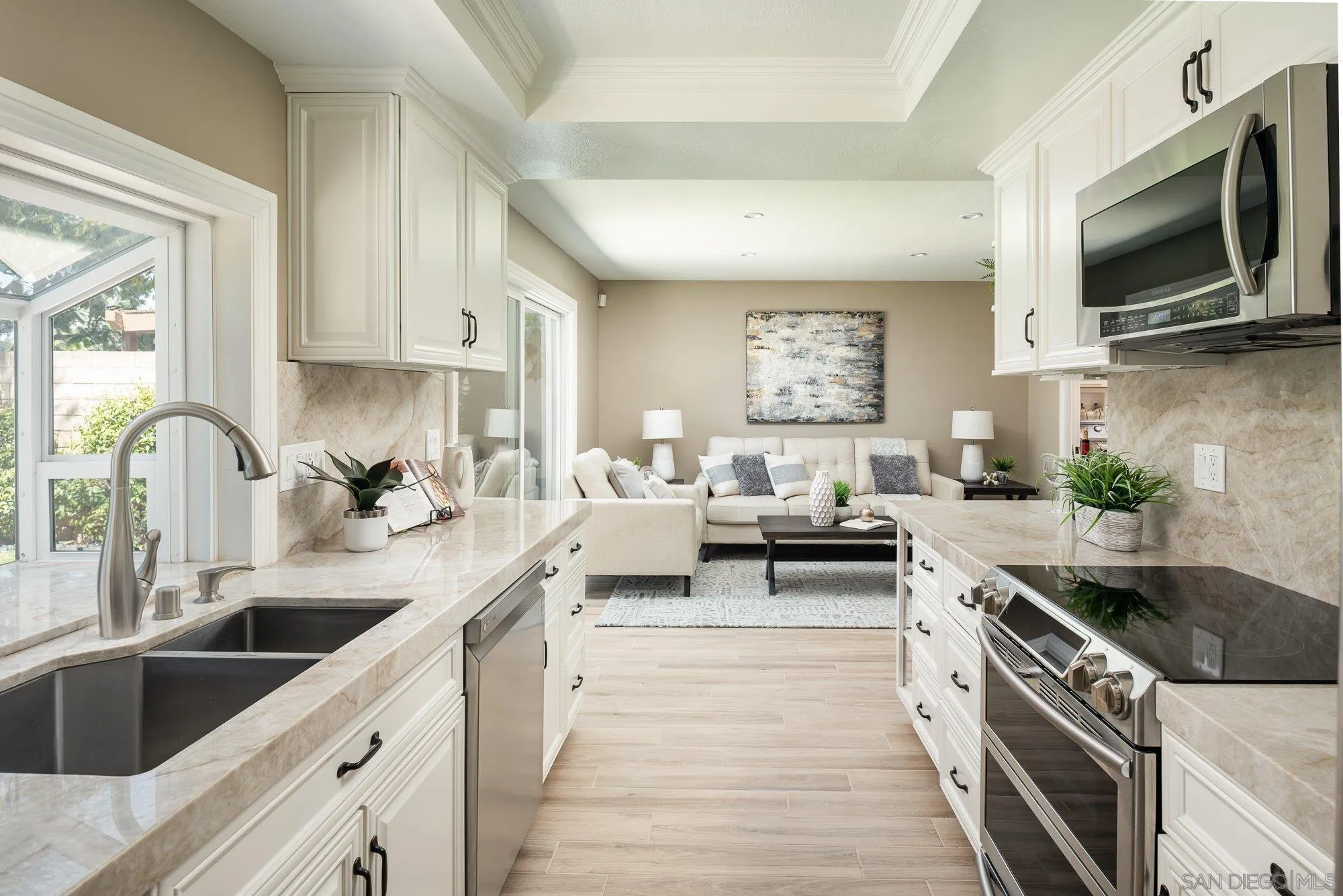 1414 Flair Encinitas Drive Encinitas, CA 92024 - Photo 9 of 41 a kitchen with stainless steel appliances a stove a sink and a microwave