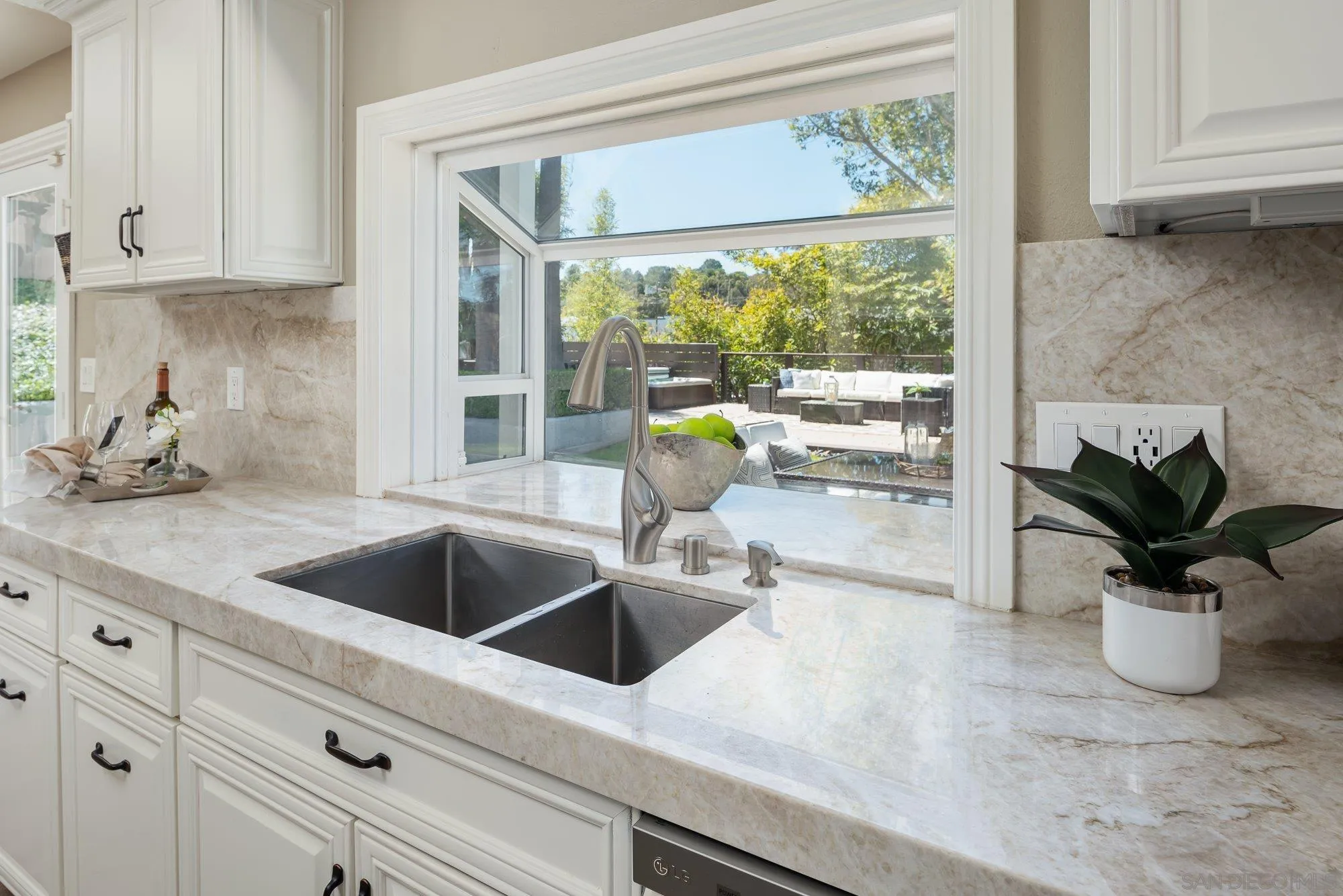 1414 Flair Encinitas Drive Encinitas, CA 92024 - Photo 10 of 41 a kitchen with a sink and a large window