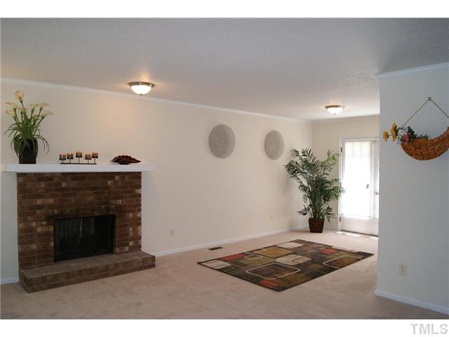3708 Summer Place Raleigh, NC 27604 - Photo 2 of 8 a living room with furniture and a fireplace
