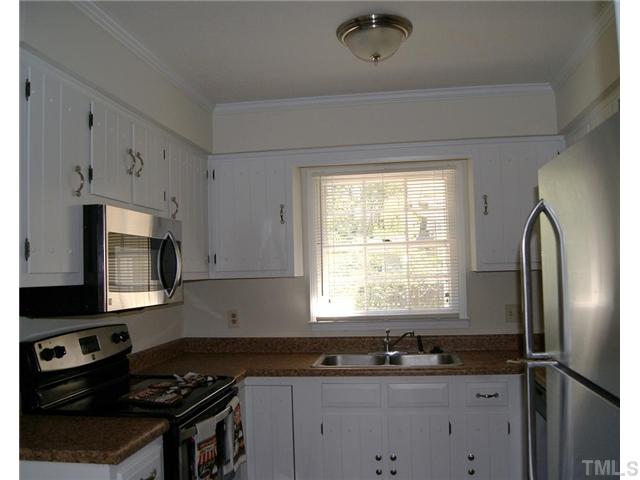 3708 Summer Place Raleigh, NC 27604 - Photo 3 of 8 a kitchen with stainless steel appliances granite countertop a sink stove and refrigerator