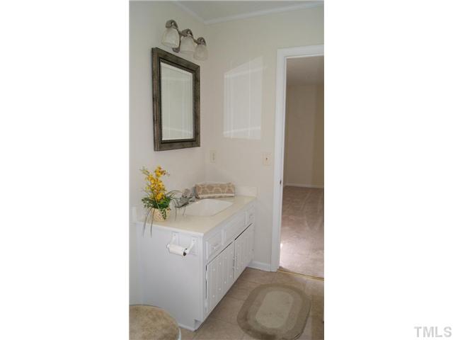 3708 Summer Place Raleigh, NC 27604 - Photo 5 of 8 a bathroom with a sink vanity and mirror
