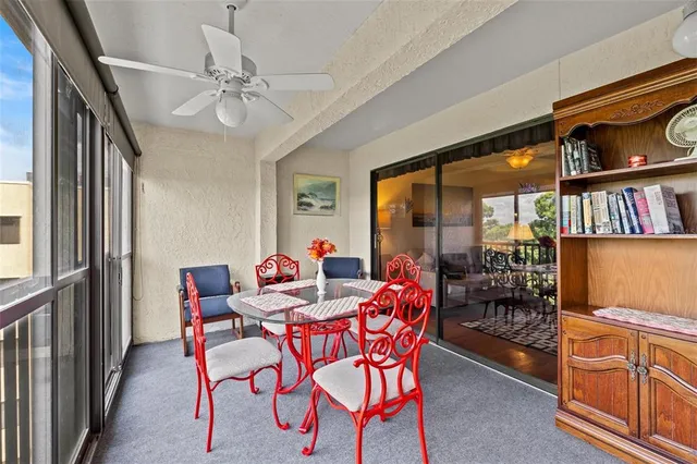 a dining room with furniture and a window
