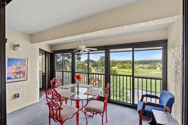 a outdoor dining space with furniture and wooden floor
