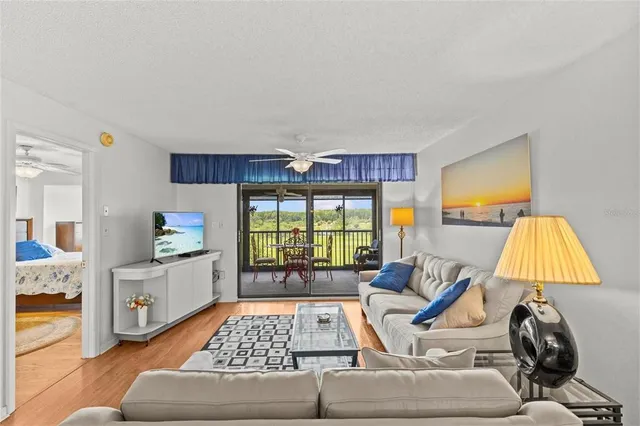 a bed room with a bed and a chair