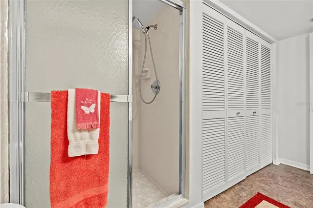 a bathroom with a shower and a sink