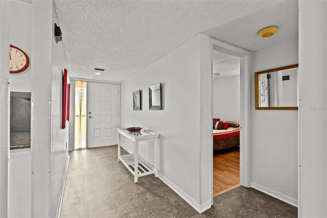 a view of room with wooden floor and window