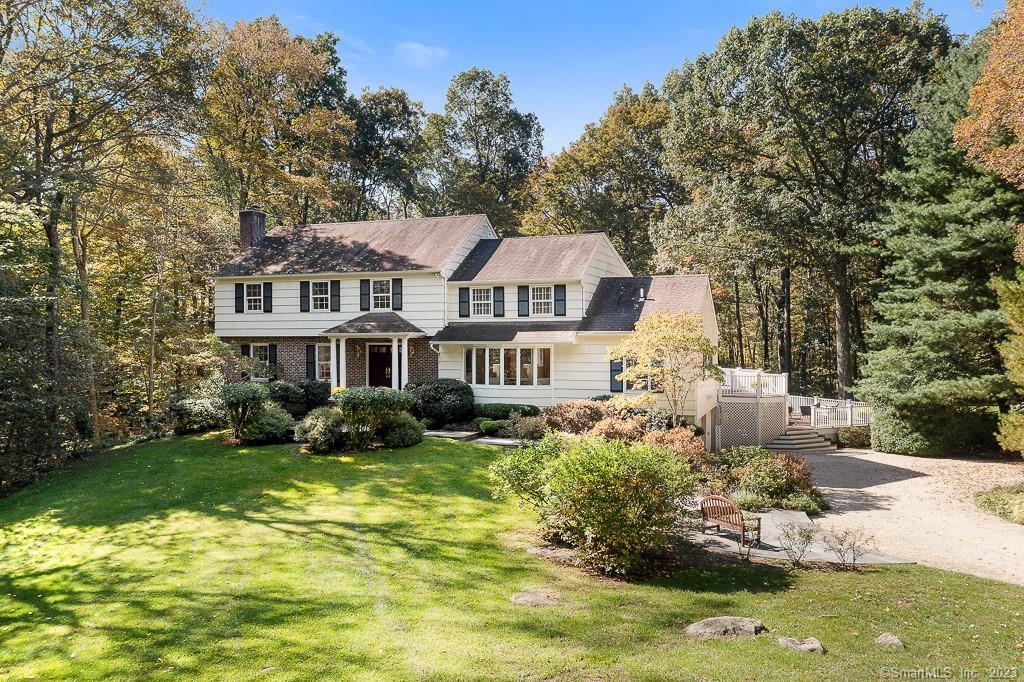 a front view of a house with a yard table and chairs