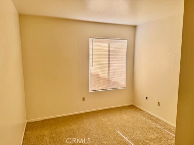 2125 Bramble Lane Palmdale, CA 93550 - Photo 15 of 28 a view of an empty room with a window