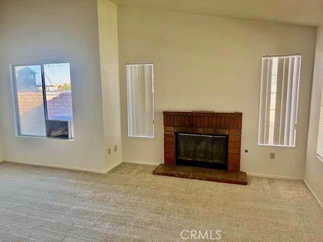 2125 Bramble Lane Palmdale, CA 93550 - Photo 4 of 28 a living room with a fireplace