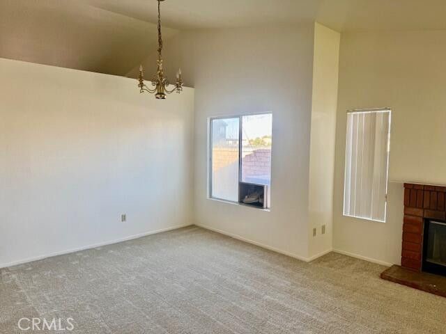 2125 Bramble Lane Palmdale, CA 93550 - Photo 6 of 28 a view of an empty room with a fireplace